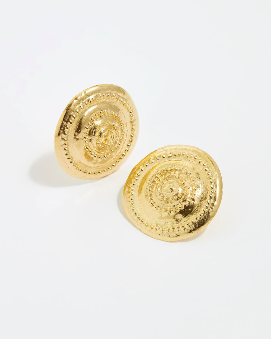 forward facing white background image of gold, round, oversized stud earrings from the daphne oz x soru collection 