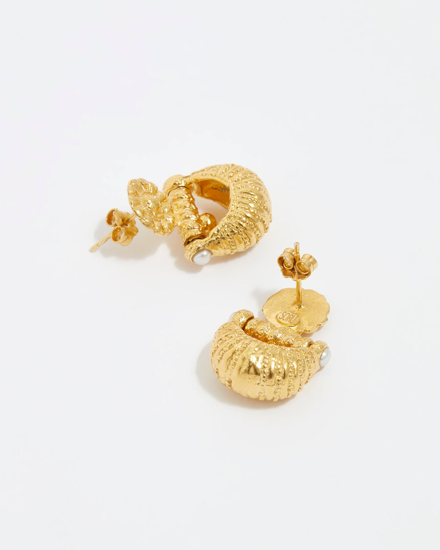 Image of gold plated small croissant shaped earrings by Soru Jewellery and Daphne Oz