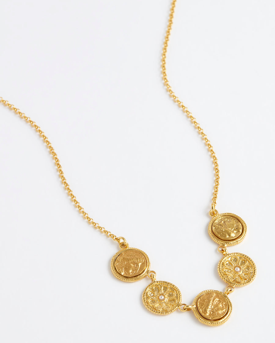 Close up detail on white background of gold plated coin chain necklace, Soru Jewellery, Daphne Oz