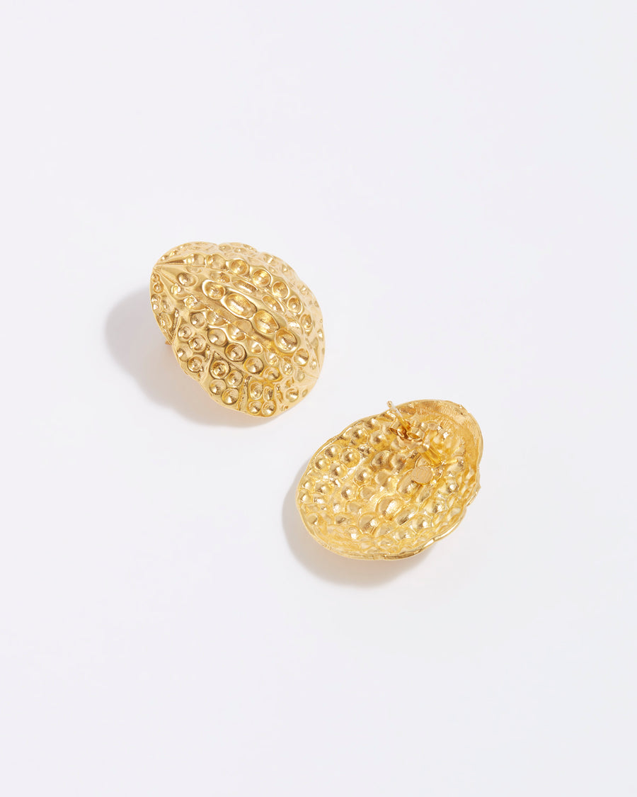 product shot of large textured gold oval oversized stud earrings