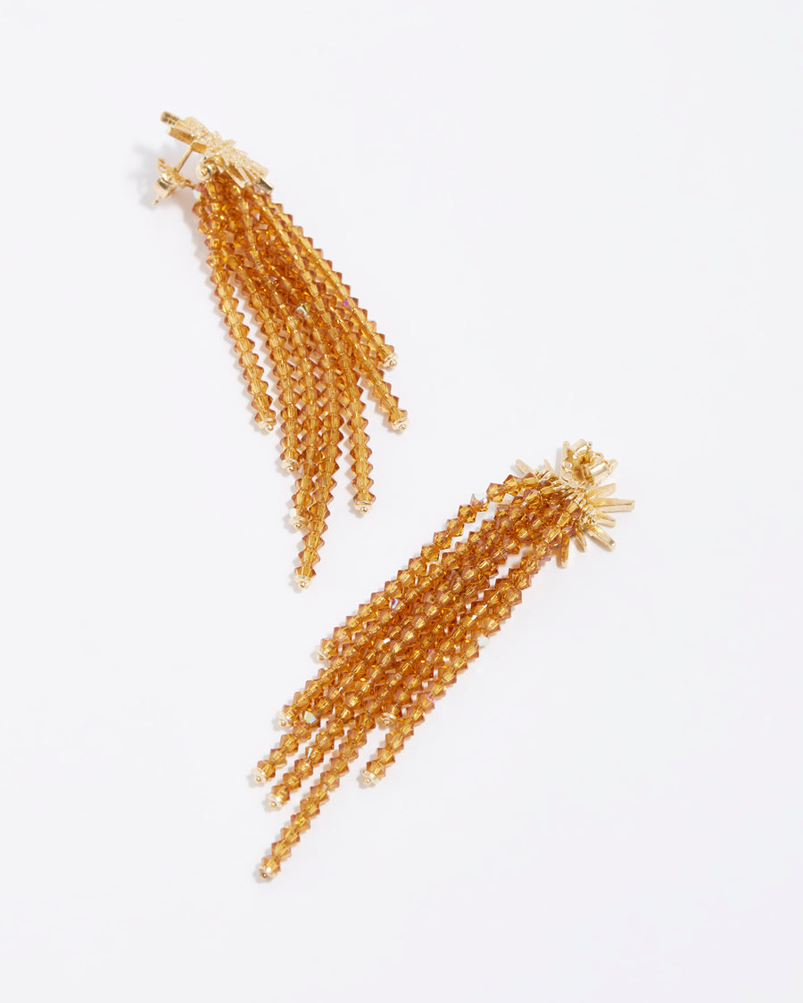 product shot of golden star earrings with sparkling crystal strands