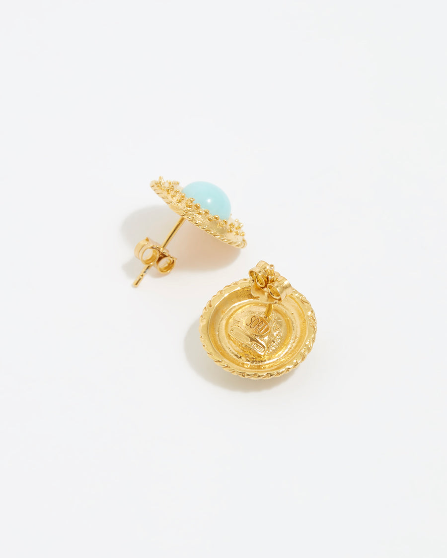 Close up, side and reverse view, overhead image of the gold textured stud earrings with turquoise centre on white background 