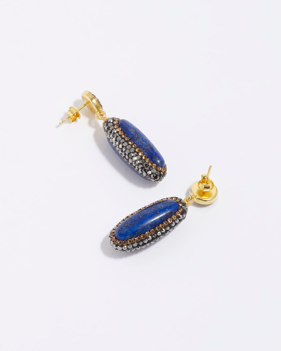 product shot of lapis long oval stone earrings surrounded by crystals