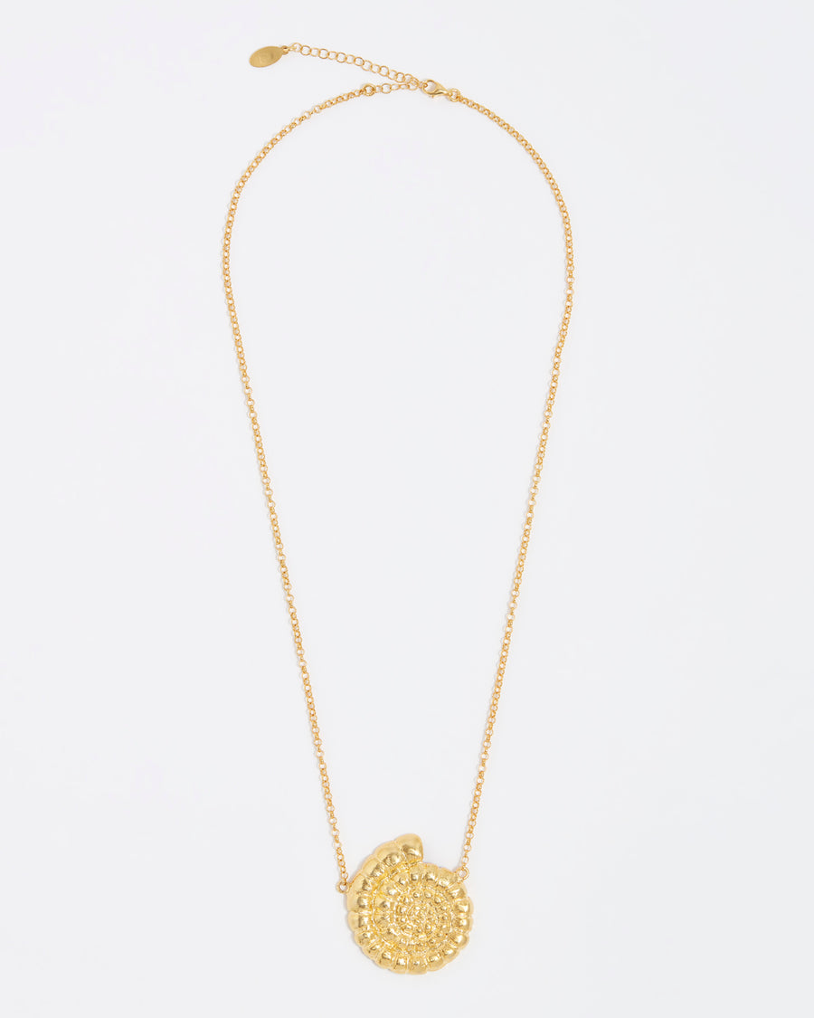 gold fossil pendant on thin chain necklace