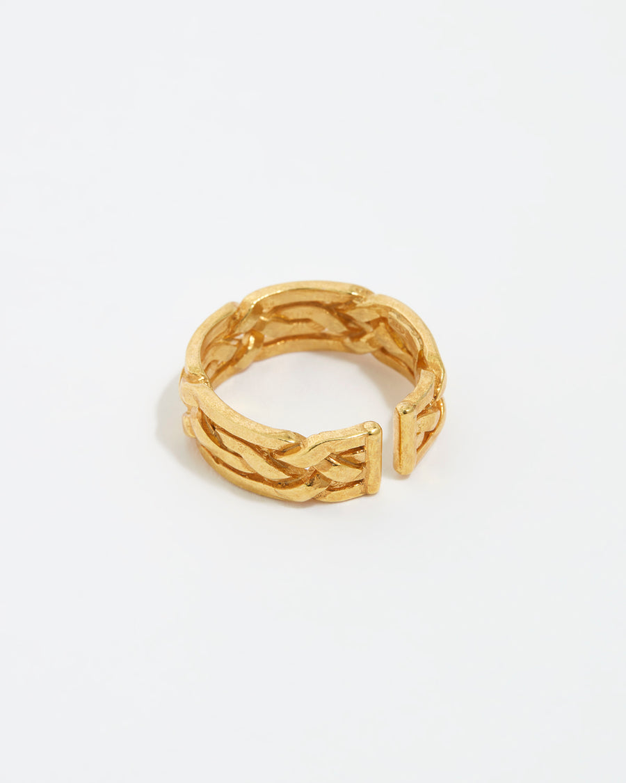 Product shot of gold braided ring on white background