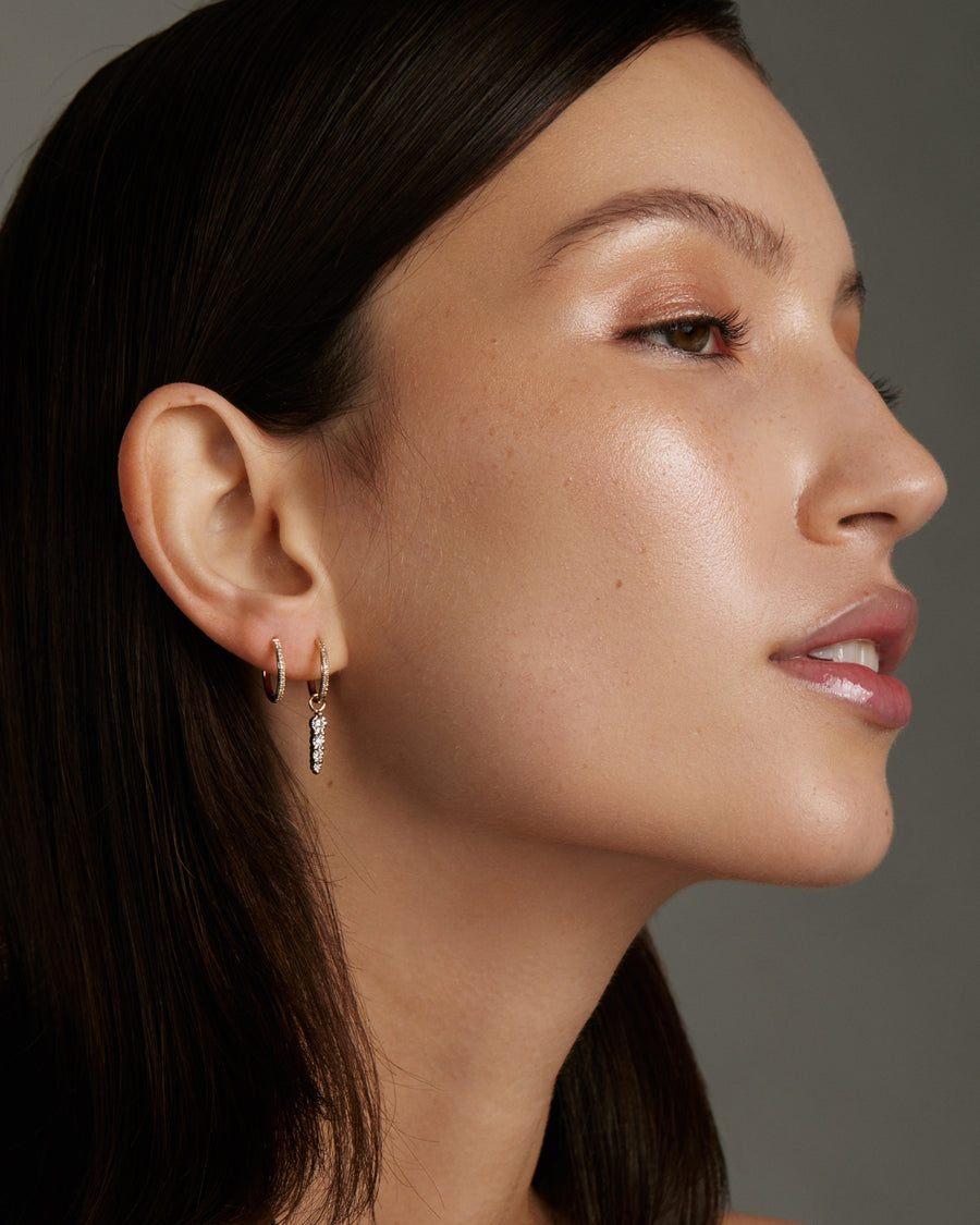 gold and diamond small hoop earring, model shot