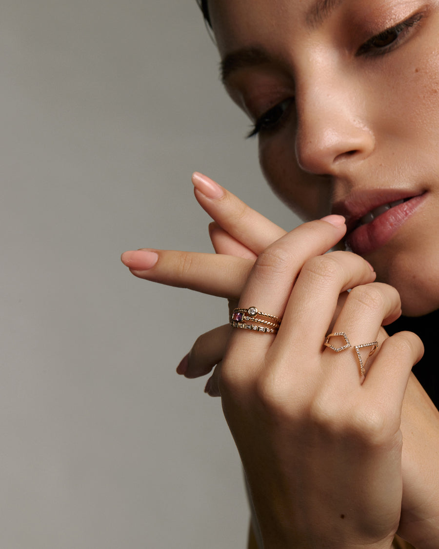 Soru Jewellery gold and diamond stacking rings on model 