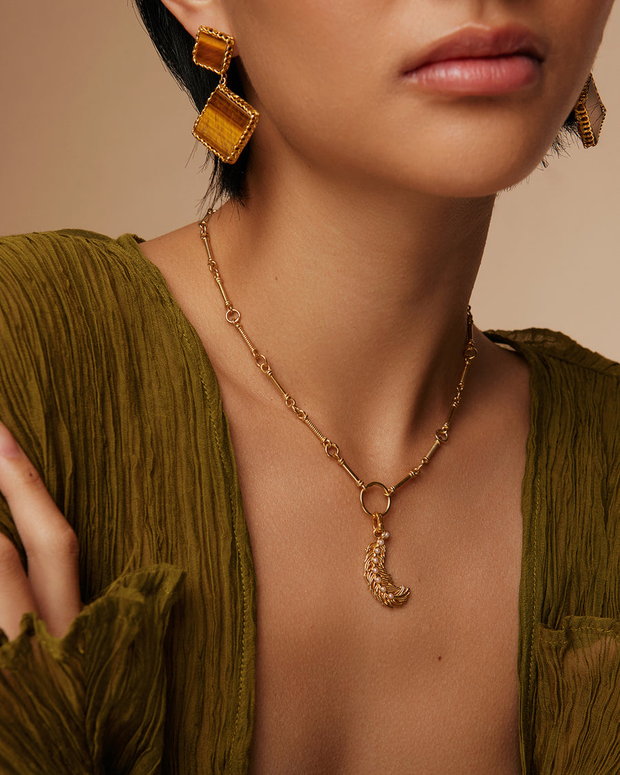 model shot of double drop square shaped tigerseye gemstones set in 18ct yellow gold plated silver setting