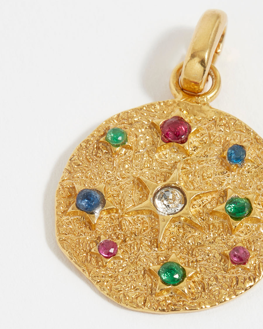 soru interchangeable circular charm with multicoloured crystal stars and an organic finish made from gold plated silver