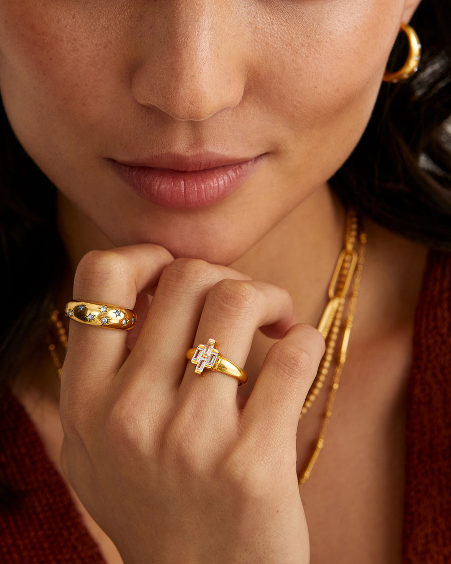 Gold ring studded with clear crystal stars 