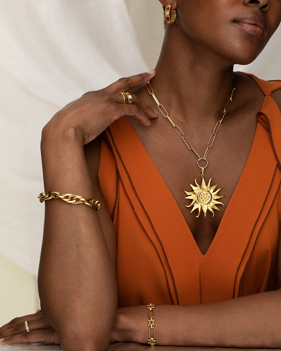 Soru Jewellery large sun charm in gold plated silver 